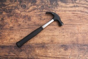 Decorative image of hammer for how to know if your roofer did a good job blog post