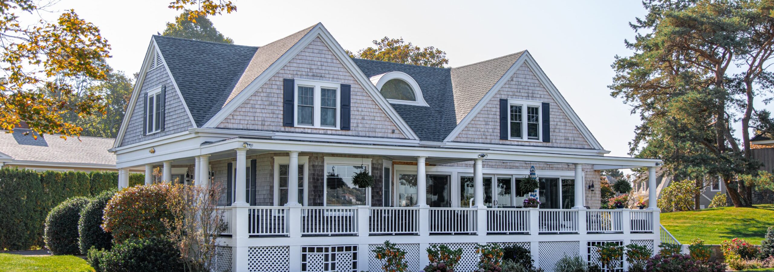 Home with roof that has multiple protrusions and valleys. flashing is very important on a roof like this